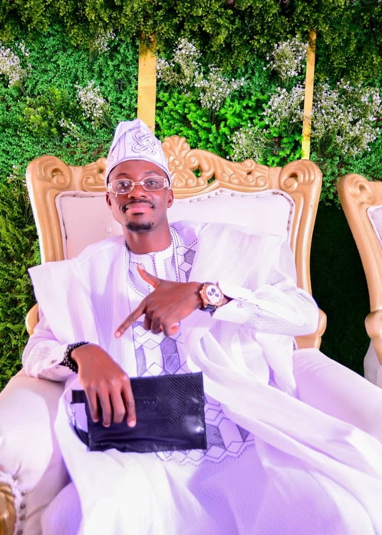 Philip Akinjobi seated in traditional attire